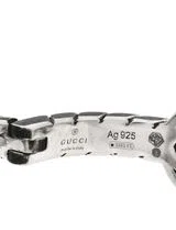 Brincos Interlocking G